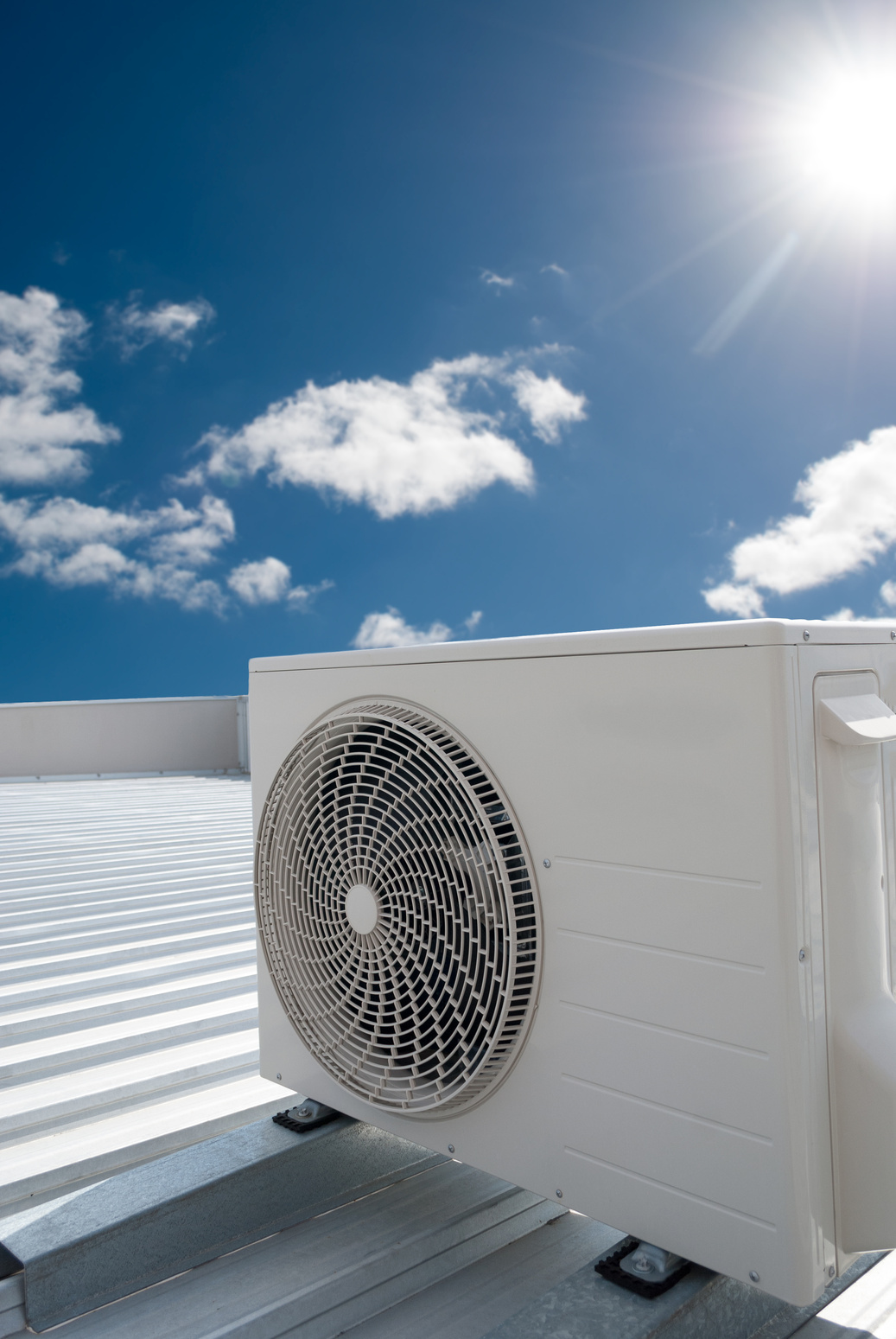 White Air Conditioning Unit on a Roof